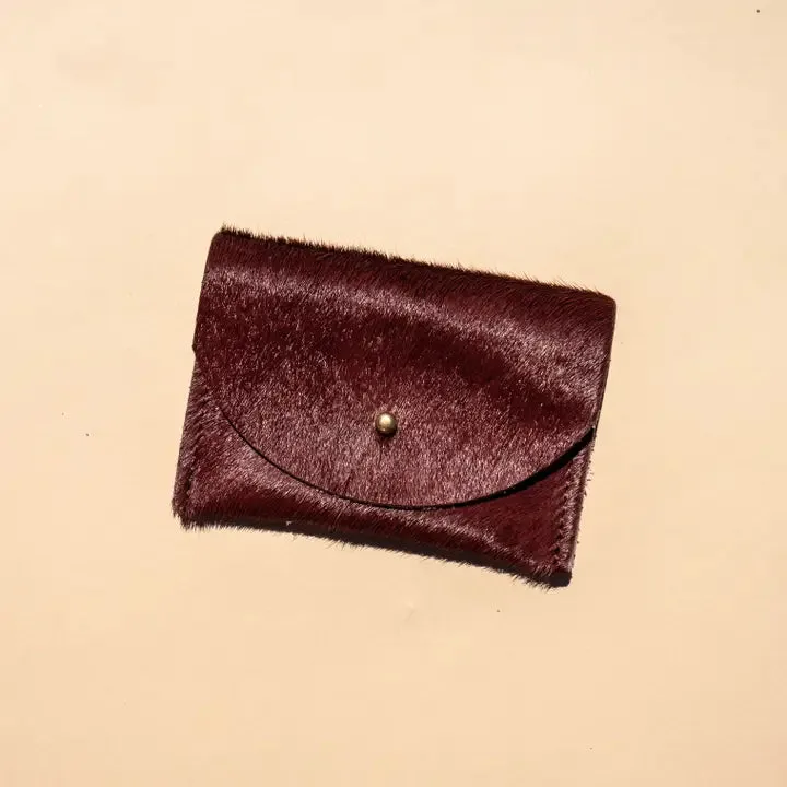 Primecut – Plum Hair on Cowhide Holder